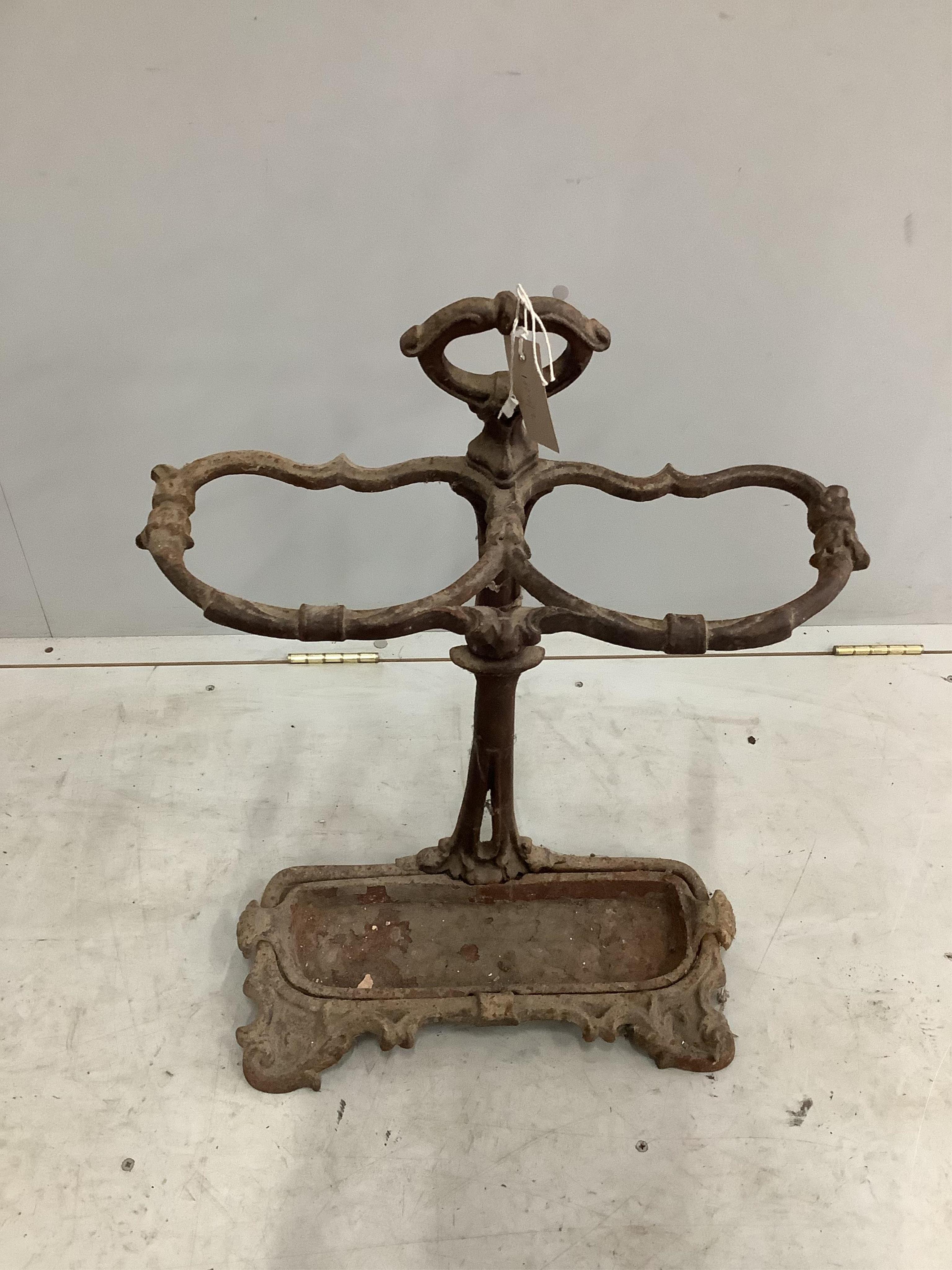 A Victorian cast iron stick stand, height 70cm. Condition - poor as paint loss and oxidised